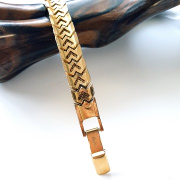 Napier goldtone flexible bracelet - Bliinkt