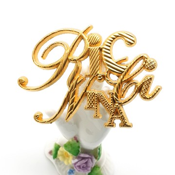 Nina Ricci - goldtone logo brooch - Bliinkt