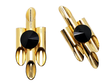 Grote goudkleurige panfluitachtige oorbellen met in het midden en zwarte plastic seen 60's