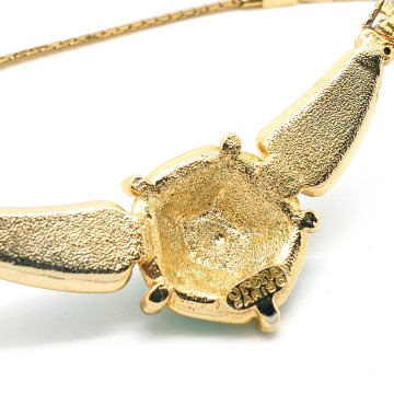 Orena Paris - goldtone short necklace with emerald green rhinestones and cabochons - Bliinkt