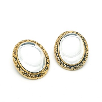 Oval domed transparant glass earrings with goldtone edge - Bliinkt