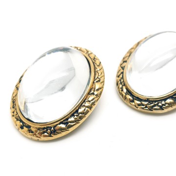 Oval domed transparant glass earrings with goldtone edge - Bliinkt