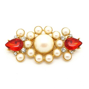 Richelieu goldtone brooch with red teardrop shaped rhinestones and faux pearls