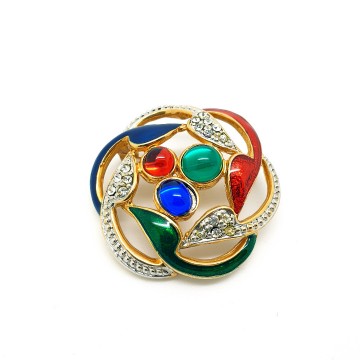 Ronde goudkleurige 80s broche met rode groene en blauwe steen en email