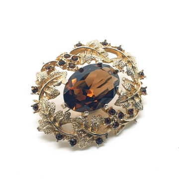 Sarah Coventry - goldtone oval brooch with topaz - Bliinkt