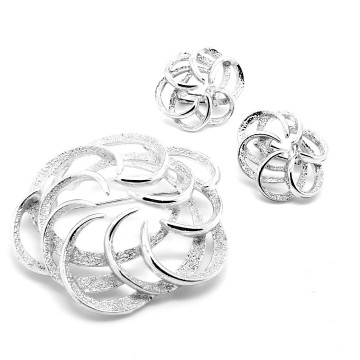 Sarah Coventry 'Tailored Swirl' 1973 silvertone brooch and earring set