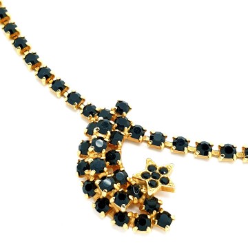 Short goldtone necklace with black rhinestones and moon and star