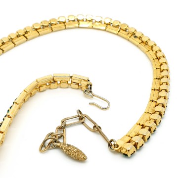 Short goldtone necklace with green rhinestones