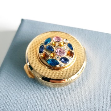 Stratton - goldtone pill box with multicolour rhinestones - Bliinkt