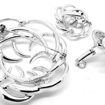 Sarah Coventry 'Tailored Swirl' 1973 silvertone brooch and earring set