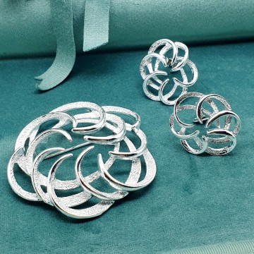 Sarah Coventry 'Tailored Swirl' 1973 silvertone brooch and earring set