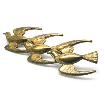 Three brass birds in flight - Bliinkt