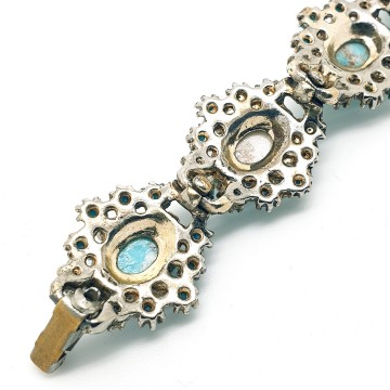 Vintage schakelarmband met turquoise cabochons - Bliinkt