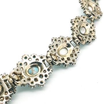 Vintage schakelarmband met turquoise cabochons - Bliinkt