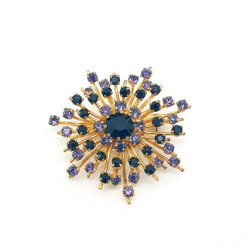 Goldtone snowflake brooch with purple rhinestones - Bliinkt