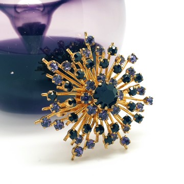 Goldtone snowflake brooch with purple rhinestones - Bliinkt