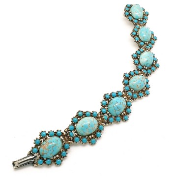 Vintage schakelarmband met turquoise cabochons - Bliinkt
