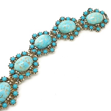 Vintage schakelarmband met turquoise cabochons - Bliinkt