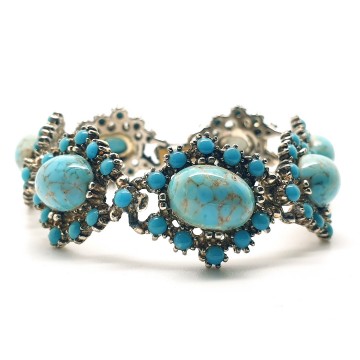 Vintage schakelarmband met turquoise cabochons - Bliinkt