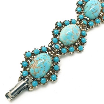Vintage schakelarmband met turquoise cabochons - Bliinkt