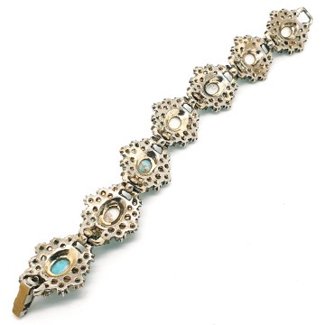 Vintage schakelarmband met turquoise cabochons - Bliinkt
