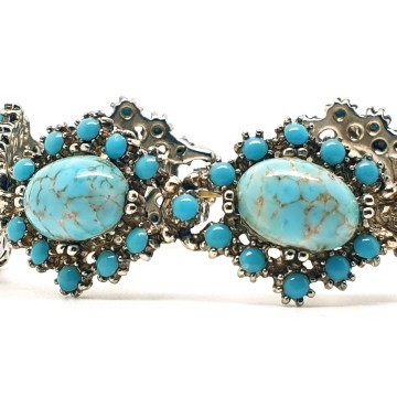 Vintage schakelarmband met turquoise cabochons - Bliinkt