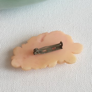 Peach coloured plastic rose brooch