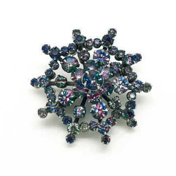Silvertone snowflake brooch with rainbow rhinestones - Bliinkt